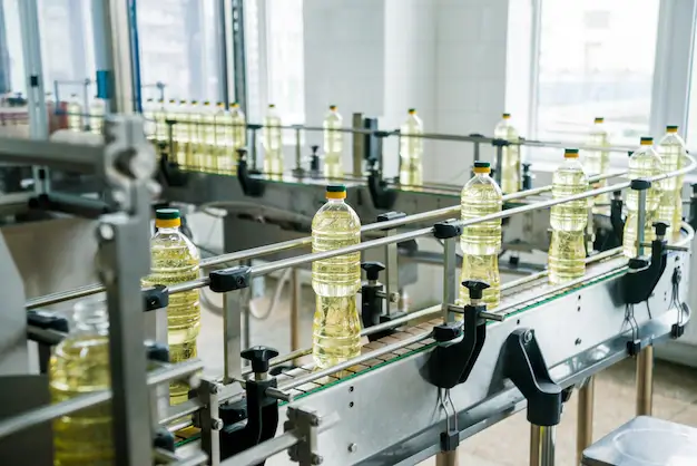 bottling-line-sunflower-oil-bottles-vegetable-oil-production-plant-high-technology_179755-2144